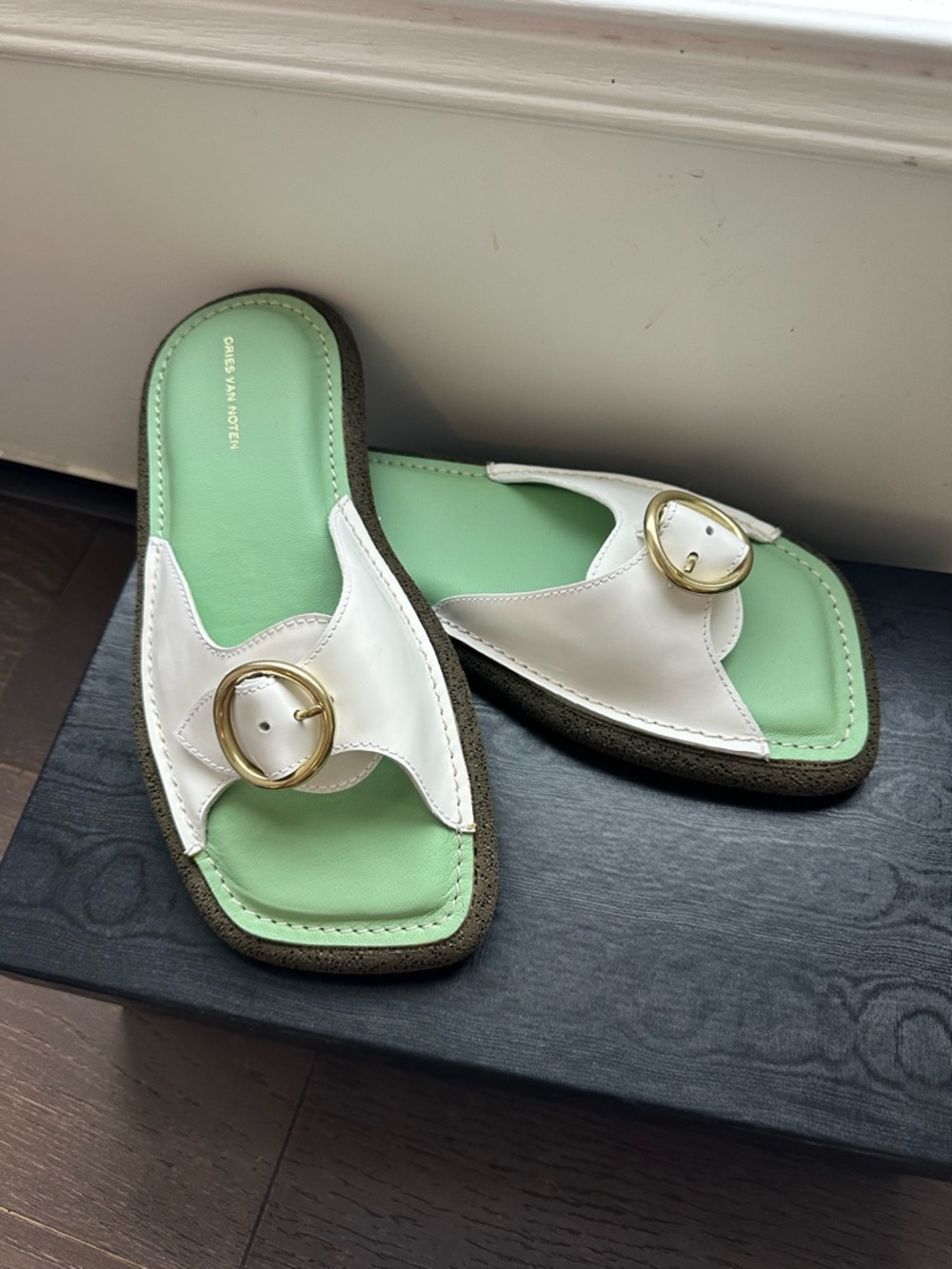 Dries Van Noten white leather slide sandals with gold buckle $615